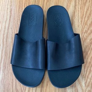 Vans Women's black slides.  New without tags or box.  Size 5